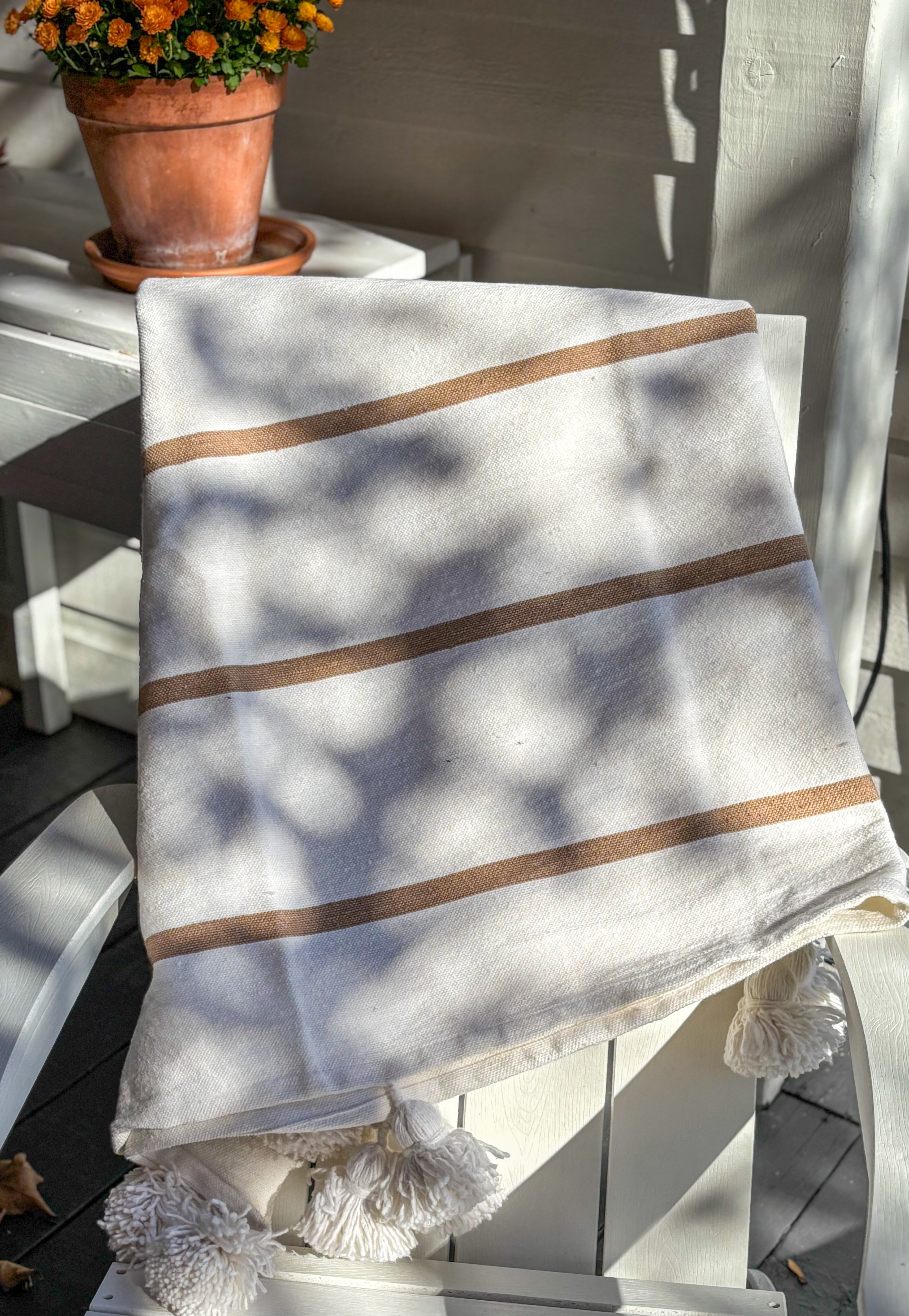 MOROCCO: Handmade Moroccan white pom-pom blanket with camel stripes